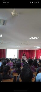Variddhi talking to a group of high school students about the emerging career options